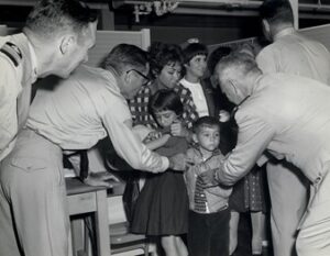 Quarantine inspectors checking children for vaccination marks, photograph by Black-Baker Photographers for U.S. Public Health Service, 1965
Courtesy of U.S. National Library of Medicine