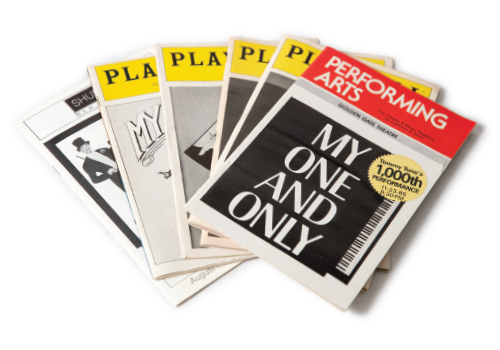 stack of playbills from Broadway musicals that starred Tommy Tune