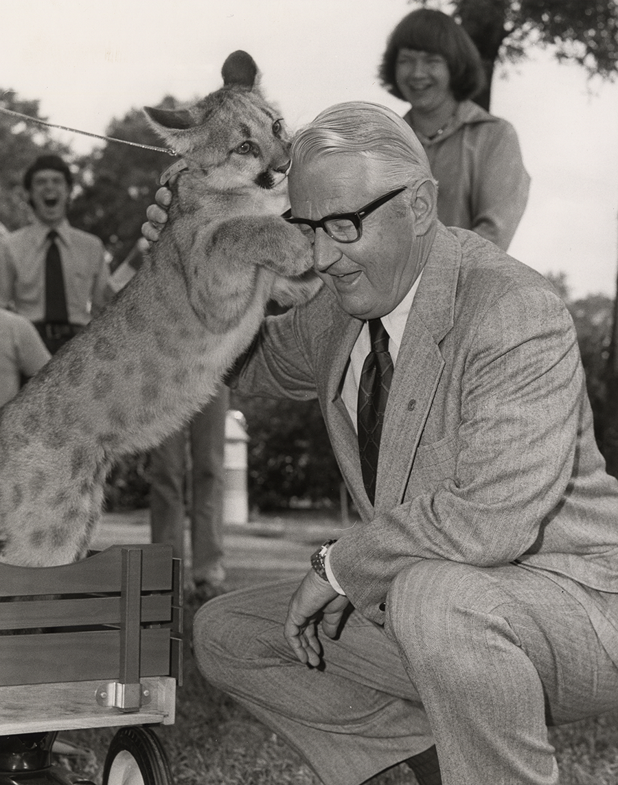 President Philip G. Hoffman posing with Shasta